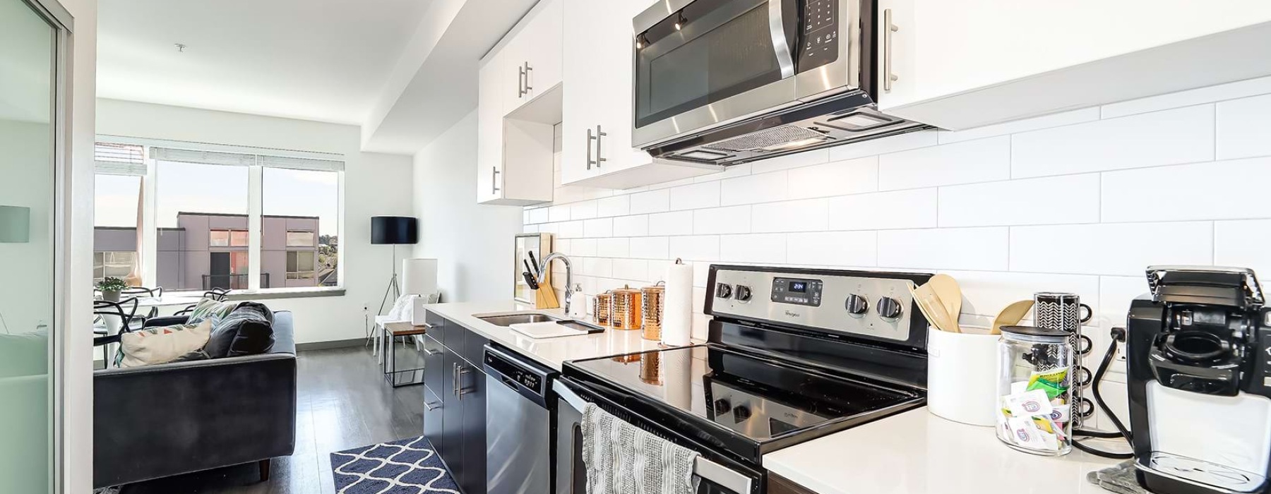 bright kitchen opens to living room